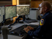 Cal Fire Ted Schaffer monitors computer screens which depicts views of wildfire camera systems in real time throughout the state of California at the Southern California Geographic Area Coordination Center on Aug. 9, 2023, in Moreno Valley, California. The agency is using AI to help monitor the camera systems.