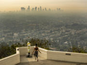 Los Angeles resident Carmen Green jumps rope at a closed Griffith Observatory in spite of dense smoke from wildfires in September 2020.