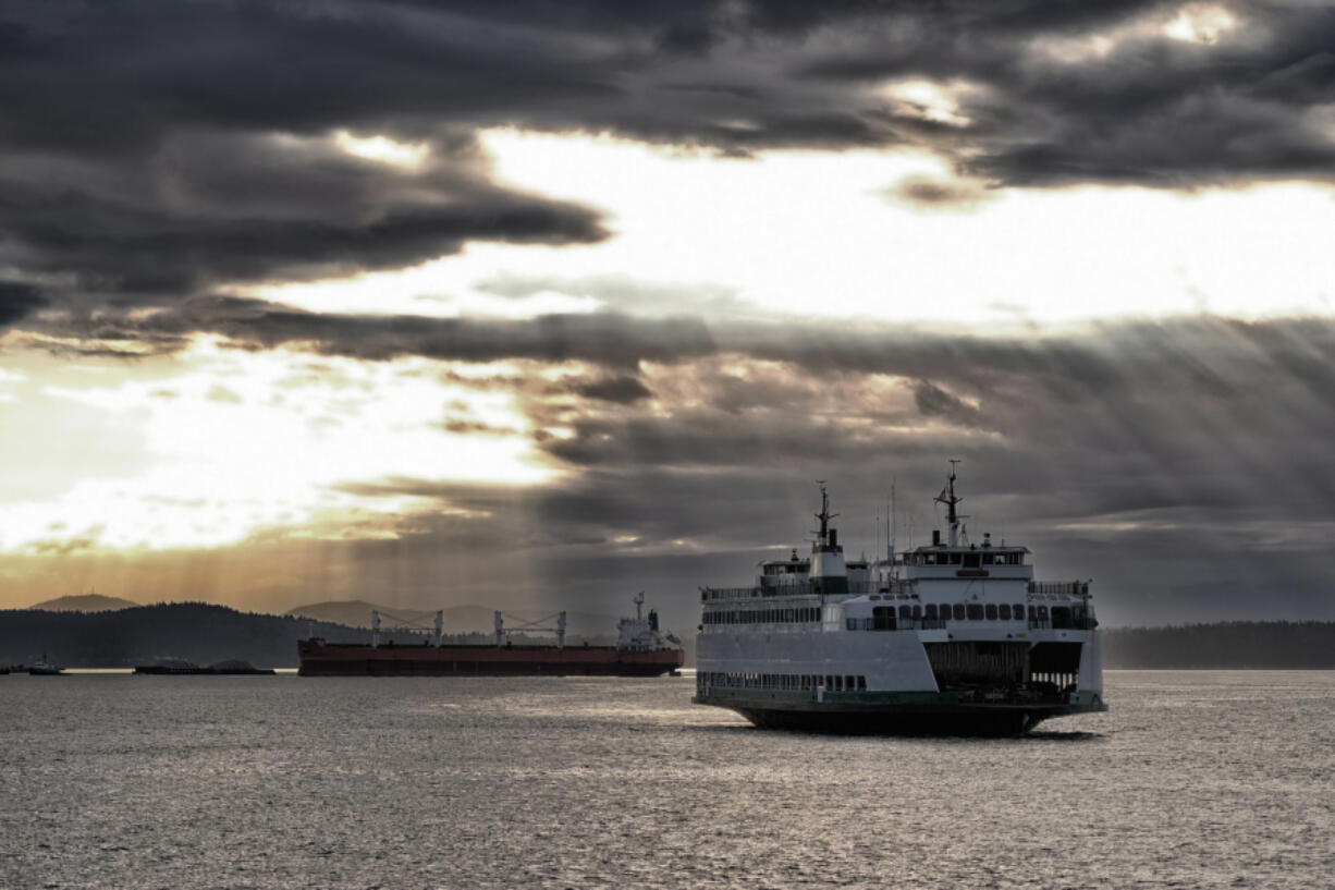 A ferry makes way across the Puget Sound between Seattle and Vashon and Bainbridge Islands