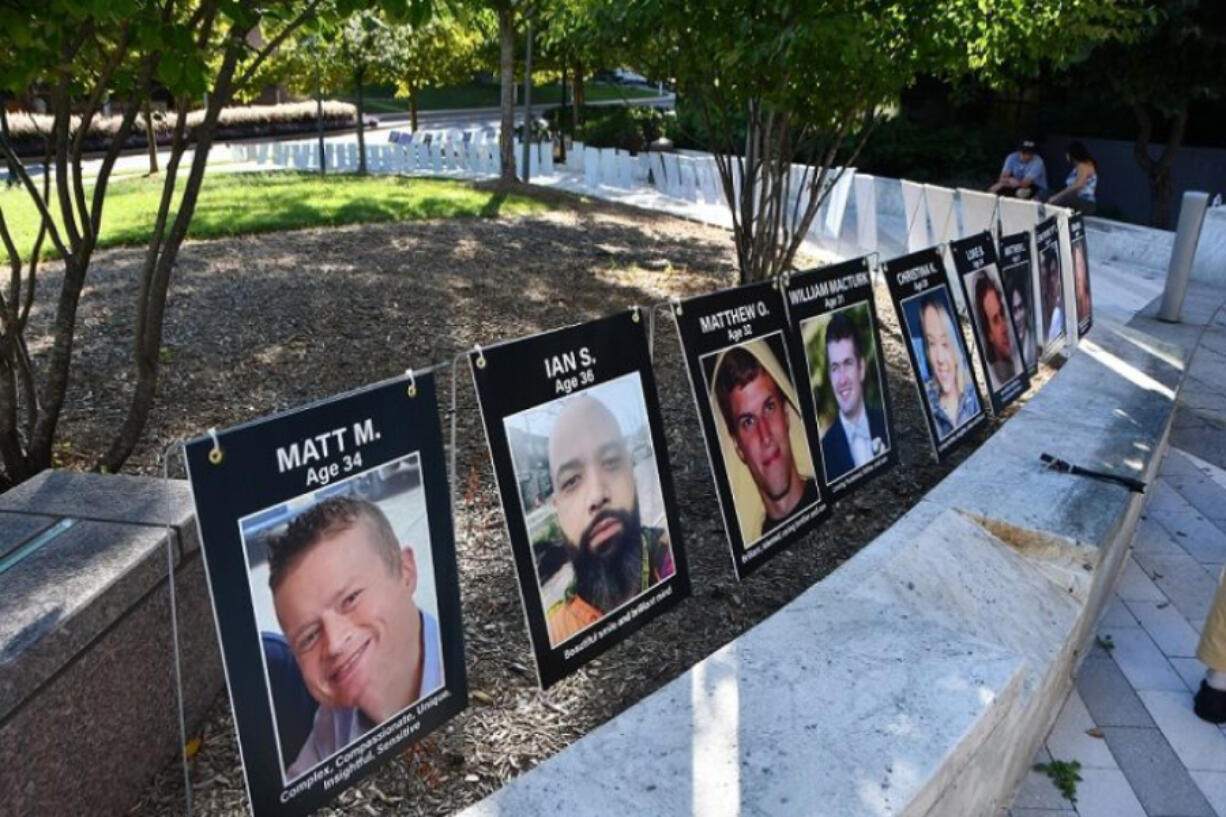 Photos of young overdose victims on display at an overdose awareness event in Rockville, Md., in August. Accidental overdose has become a primary cause of deaths for people under 40.