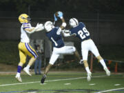 Skyview's Riley Artis (1) makes an interception in the first quarter during the Storm's 49-0 win over Columbia River on Friday at Kiggins Bowl.