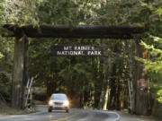 A car passes through the entrance to Mount Rainier National Park on March 18, 2020. (Ted S.