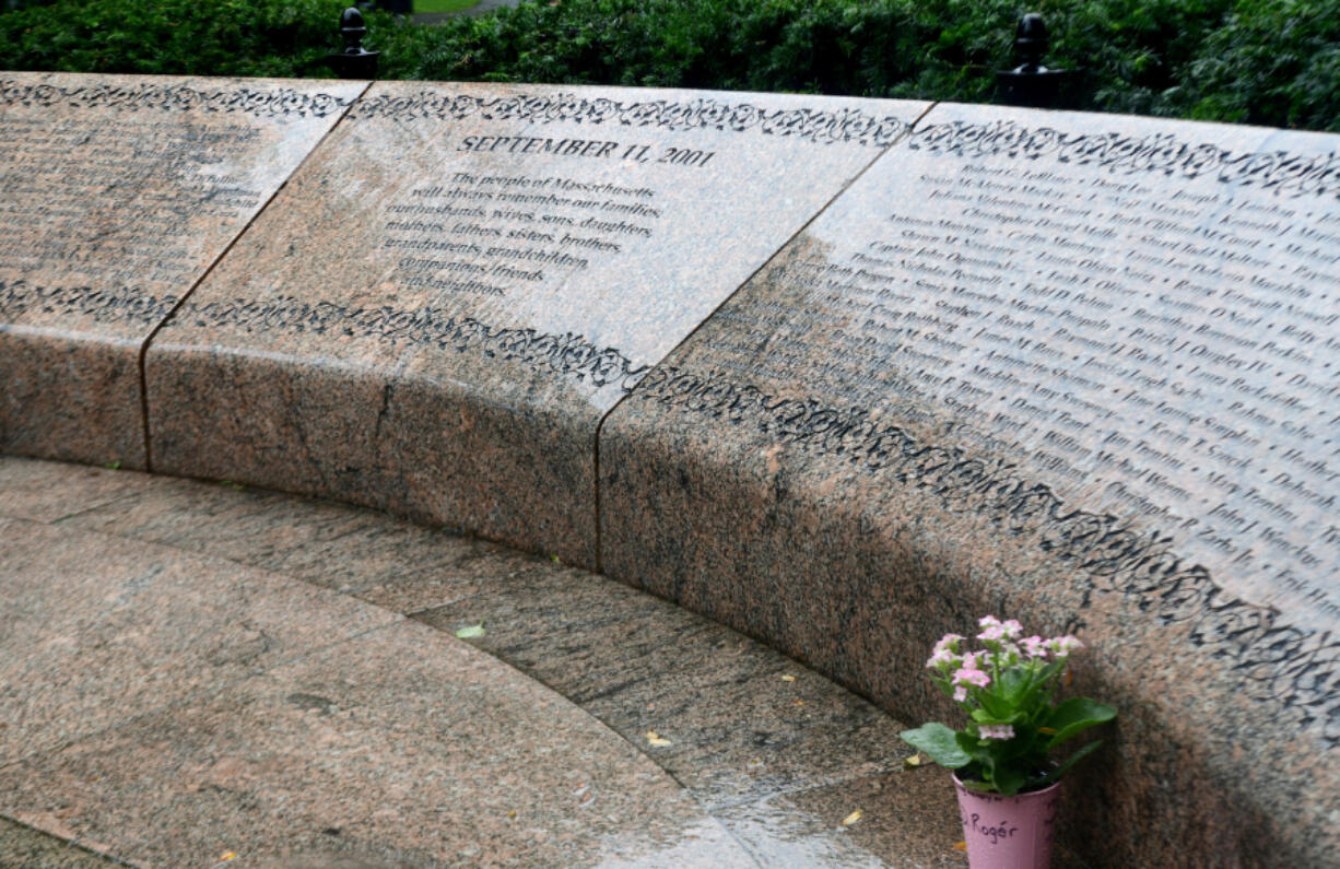 A lone plant sits by the 9/11 memorial during the rain on Sunday, Sept. 10, 2023, at Public Garden in Boston Massachusetts.