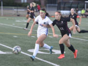 Mountain View's Courtney Shum, left, and Prairie's Avery Hoskins battle for the ball in a 3A Greater St. Helens League soccer match on Monday, Sept, 11, 2023 at Prairie High School.