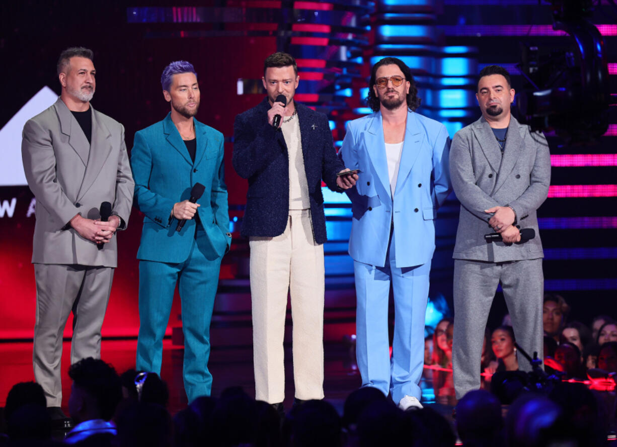 From left, Joey Fatone, Lance Bass, Justin Timberlake, JC Chasez and Chris Kirkpatrick of NSYNC speak onstage the 2023 MTV Video Music Awards at Prudential Center on Sept. 12, 2023, in Newark, New Jersey.