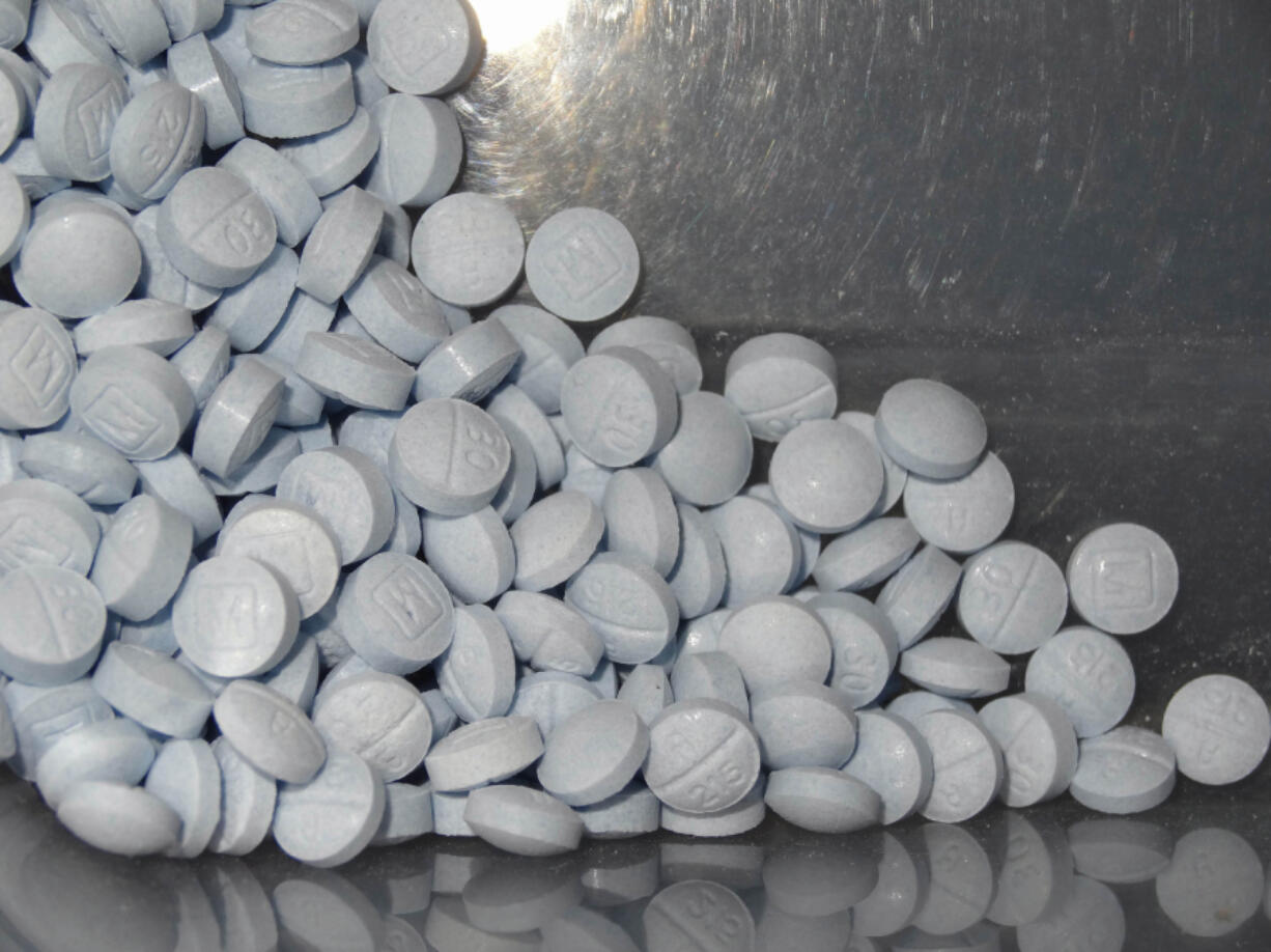 FILE - This undated file photo provided by the U.S. Attorneys Office for Utah and introduced as evidence at a trial shows fentanyl-laced fake oxycodone pills collected during an investigation. Accidental overdoses contribute to 90 percent of all U.S. opioid-related deaths. Rising use of illicitly manufactured and highly potent synthetic opioids including fentanyl has likely contributed to the unintentional death rate, which surged nine-fold between 2000 and 2017, the study found.  (U.S.