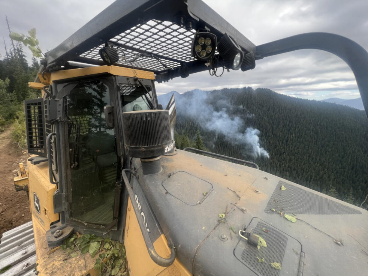 Crews are creating contingency lines around fires in the Gifford Pinchot National Forest to act as a safety net in case they grow, something fire managers say is unlikely thanks to cool, wet weather.