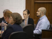 Defendant Guillermo Raya Leon, right, is pictured with his defense team Sept. 8 at the Clark County Courthouse before opening statements in his aggravated murder trial. Prosecutors rested their case against him Wednesday afternoon.