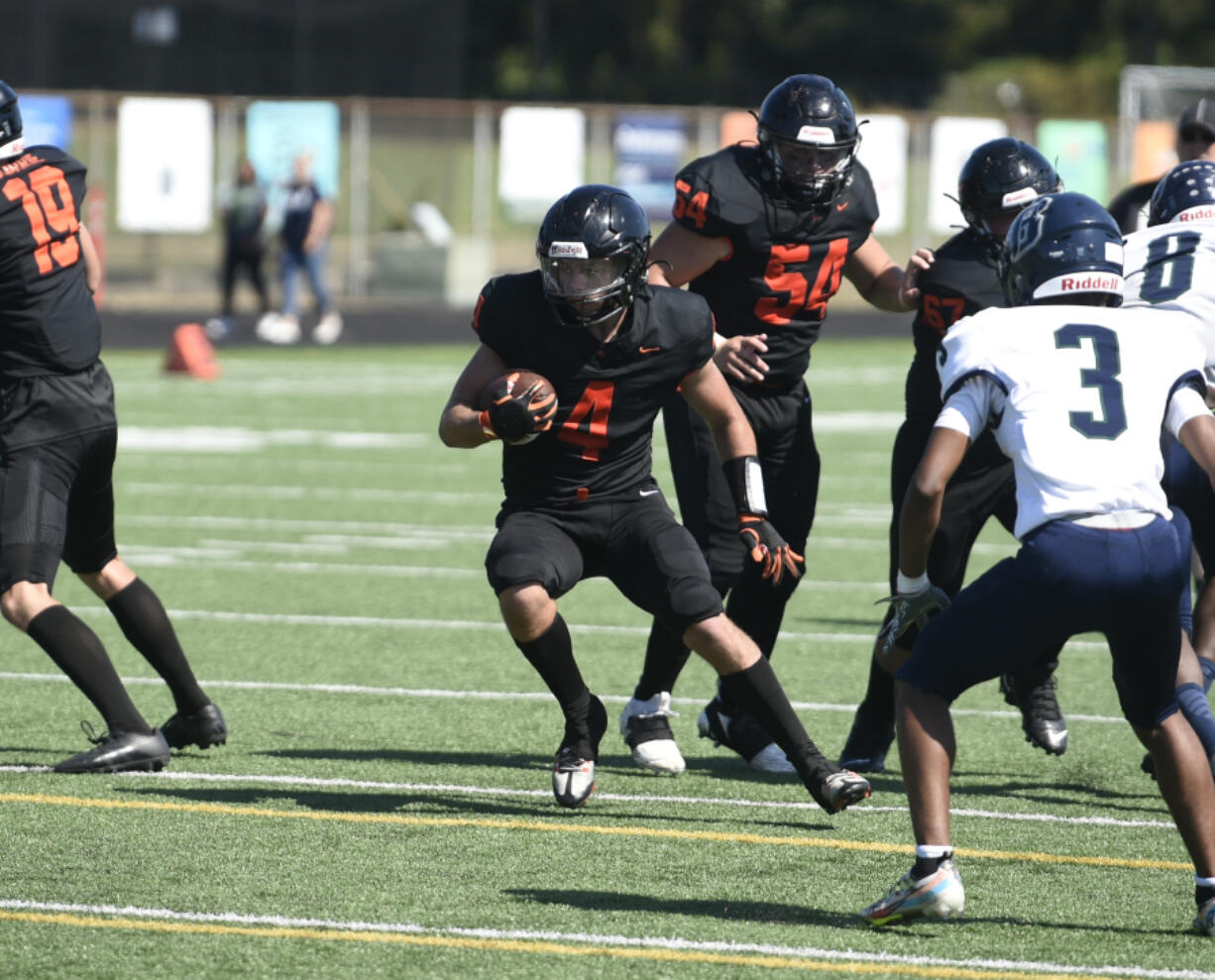 Battle Ground senior Jacob Champine carries the ball against Todd Beamer on Saturday, Sept. 9, 2023 at District Stadium in Battle Ground.