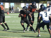 Battle Ground senior Jacob Champine carries the ball against Todd Beamer on Saturday, Sept. 9, 2023 at District Stadium in Battle Ground.