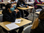 Anastasha Kathireson listens to Dean of Students Rosalia Burson lead their team in an exercise on day one of a two-day Jumpstart orientation program for incoming 9th graders  at Mount Tahoma High School in Tacoma, Wash., Aug. 25, 2021. About 120 students participated in the program, which is meant to help ease the transition to high school.