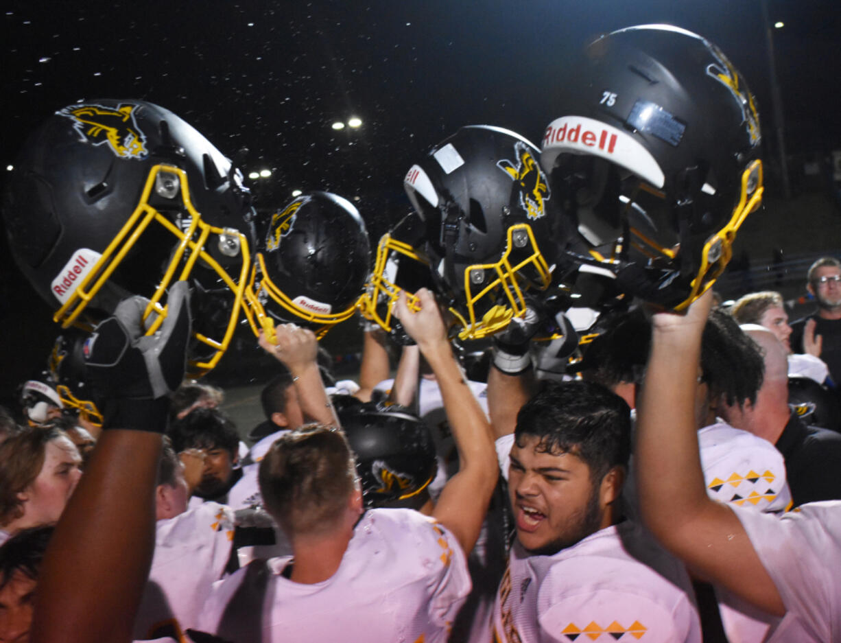 Hudson's Bay players celebrate after the Eagles' 28-24 win over Ridgefield at Ridgefield High School on Friday, Sept. 22, 2023.