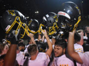 Hudson's Bay players celebrate after the Eagles' 28-24 win over Ridgefield at Ridgefield High School on Friday, Sept. 22, 2023.