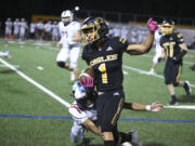 Hudson's Bay running back Rafael Bauman tries to elude a Mark Morris defender on Friday, Sept 29, 2023 at Kiggins Bowl.