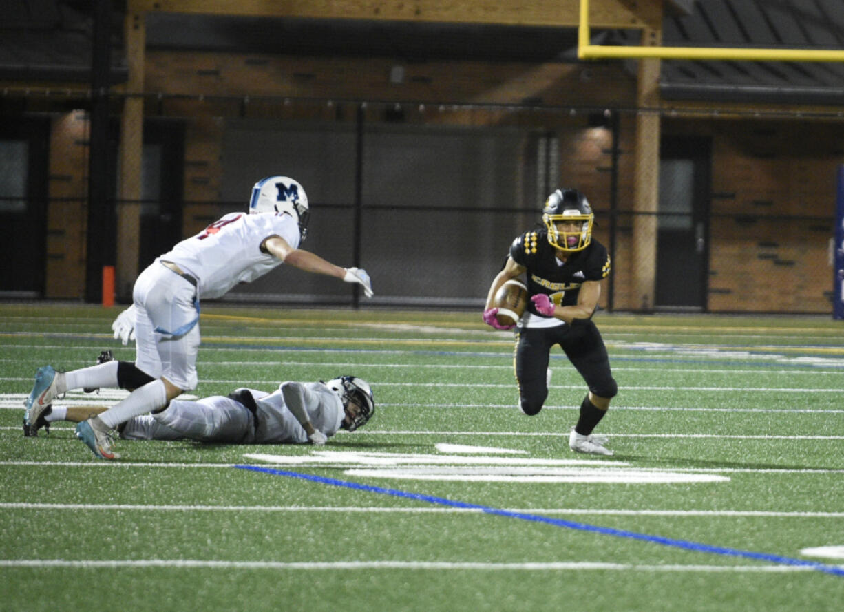 Hudson's Bay running back Rafael Bauman eludes two Mark Morris defenders on Friday, Sept 29, 2023 at Kiggins Bowl.