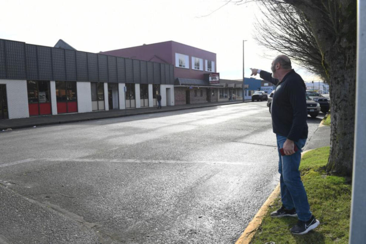 Director Frank Morrison points in January to 12th Avenue buildings Community House on Broadway would like to make into a youth shelter. Community House received a $5.3 million state grant to help fund the project but is still requesting $2.5 million from the county.