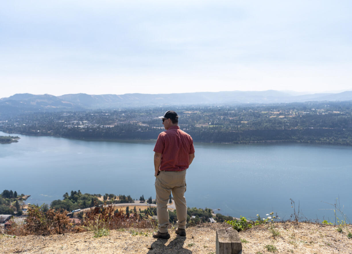 Underwood Conservation District Firewise coordinator Dan Richardson looks over the Columbia River near where the Tunnel Five Fire in July crept up the hillside above Underwood.
