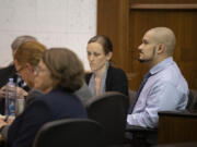 Defendant Guillermo Raya Leon, right, with his defense team Sept. 8 at the Clark County Courthouse before opening statements in his aggravated murder trial.