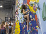 Kalea Maluenda-Telles, 10, right, climbs at Lucia Aberin's birthday party at The Source Climbing Center on Sept. 10.