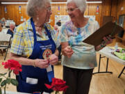 Members and guests at the Sept. 7 meeting of the Fort Vancouver Rose Society celebrated the 70th anniversary of the organization.