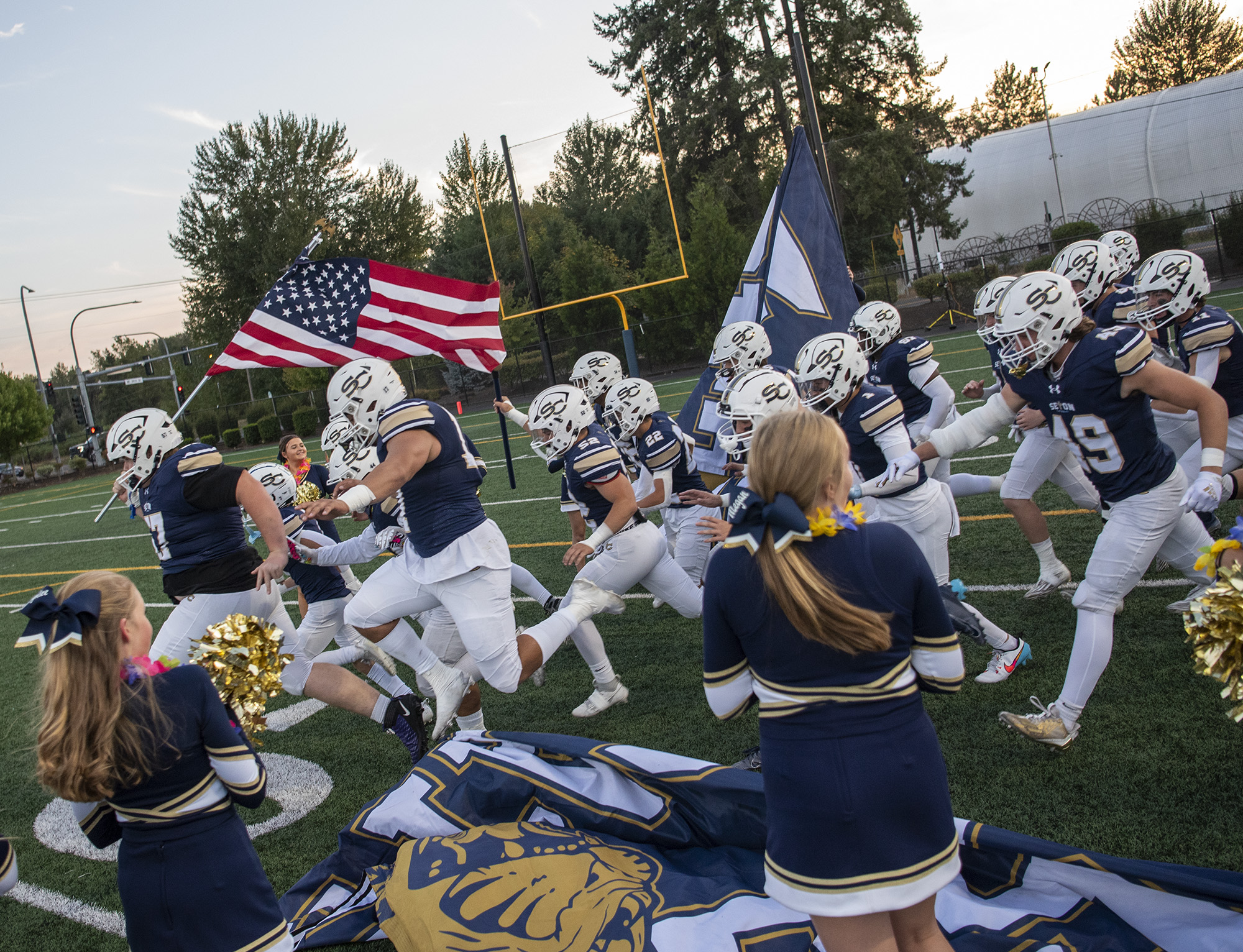 Seton Catholic storms onto the field Friday, Sept. 22, 2023, before the Cougars’ game against Stevenson at Seton Catholic High School.