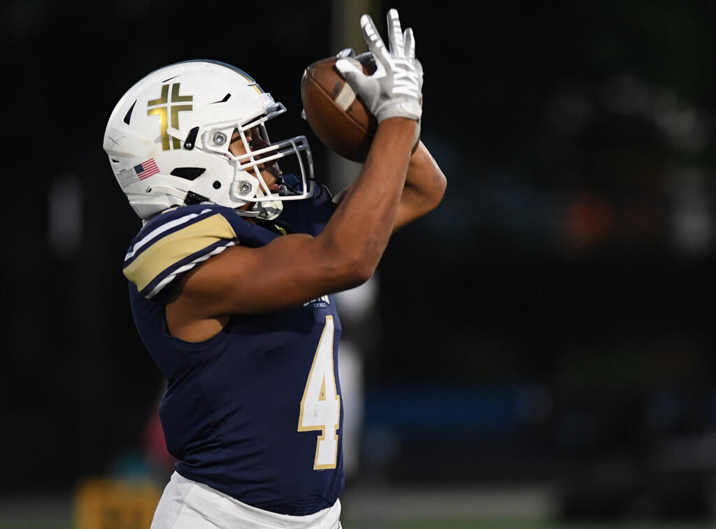 Seton Catholic junior Jacob Williams catches the ball Friday, Sept. 22, 2023, during the Cougars’ 59-0 win against Stevenson at Seton Catholic High School.