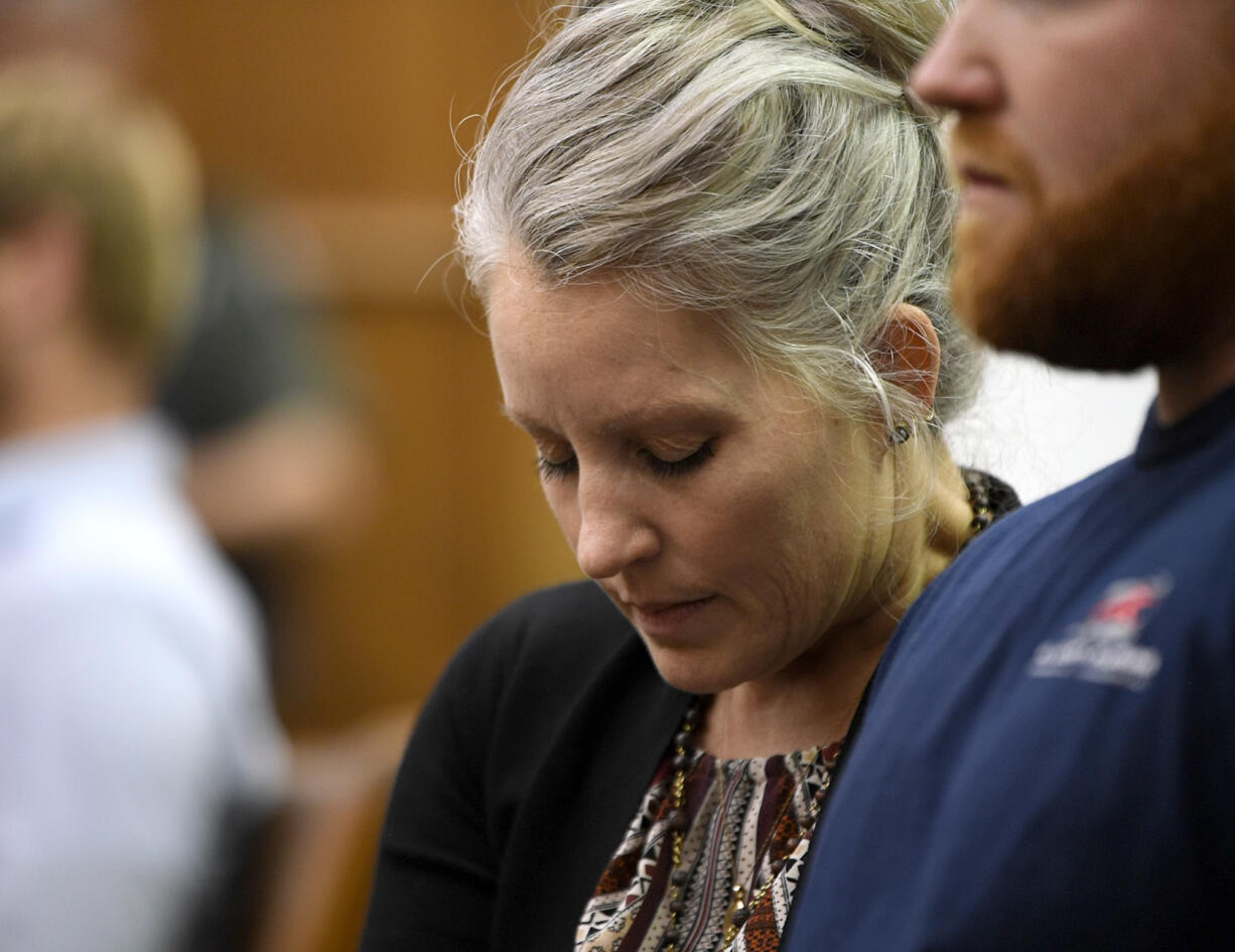 Jill Brown, wife of Clark County sheriffÄôs Sgt. Jeremy Brown, closes her eyes and listens while Clark County Superior Court Judge Derek Vanderwood reads the juryÄôs verdict Tuesday, Sept. 26, 2023, at Clark County Courthouse. Raya Leon was found guilty on all counts.