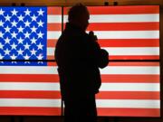 California Incident Management Team 13 Incident Commander Mike Wakoski leads the Pledge of Allegiance before the Cowlitz Complex Morning Briefing. Saluting the flag every morning on incidents is one of the many legacies Wakoski established during his career.