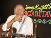 FILE - Jimmy Buffett takes a break during a set of music at his Margaritaville Cafe in Key West, Fla in Feb. 12, 2009. Buffett, who popularized beach bum soft rock with the escapist Caribbean-flavored song “Margaritaville” and turned that celebration of loafing into an empire of restaurants, resorts and frozen concoctions, has died, Friday, Sept. 1, 2023.