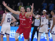 Germany center Johannes Voigtmann celebrates after winning against the United States in a Basketball World Cup semi final game in Manila, Philippines, Friday, Sept. 8, 2023.