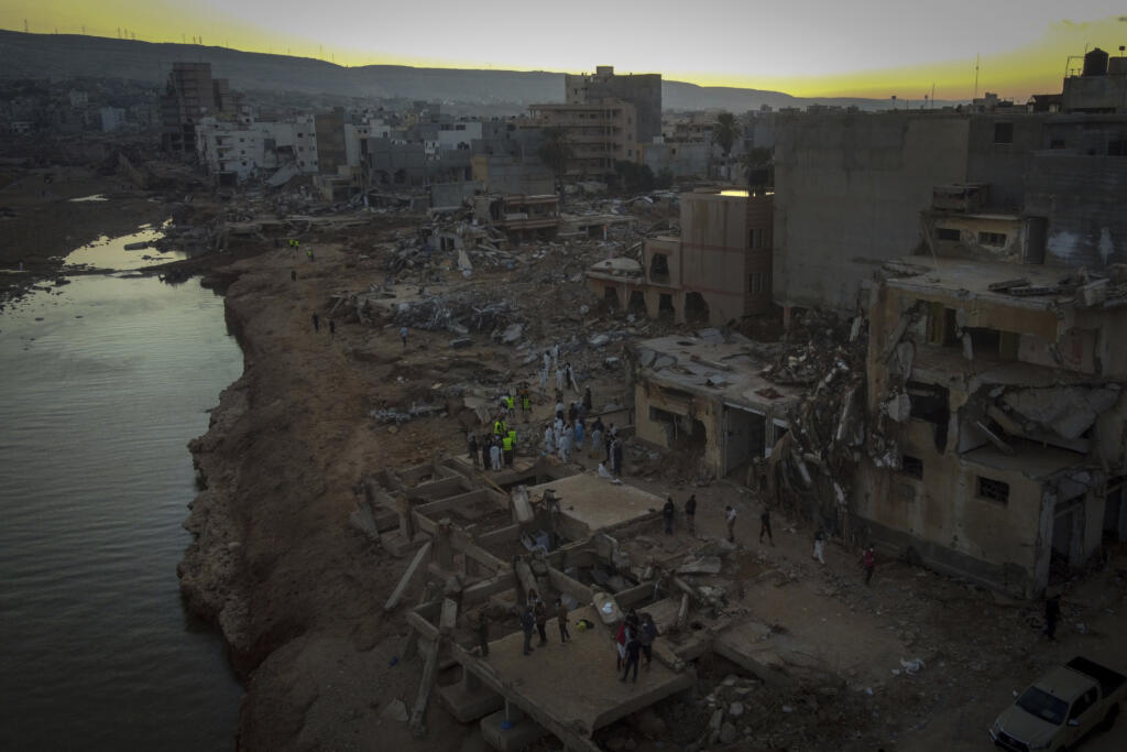 People search for flood victims in Derna, Libya, Friday, Sept. 15, 2023. Search teams are combing streets, wrecked buildings, and even the sea to look for bodies in Derna, where the collapse of two dams unleashed a massive flash flood that killed thousands of people.