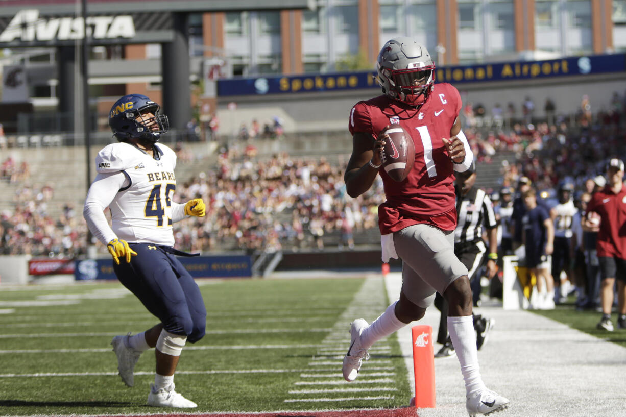 Washington State quarterback Cameron Ward (1) runs for a touchdown next to Northern Colorado linebacker Tama Tuitele during the first half of an NCAA college football game, Saturday, Sept. 16, 2023, in Pullman, Wash.