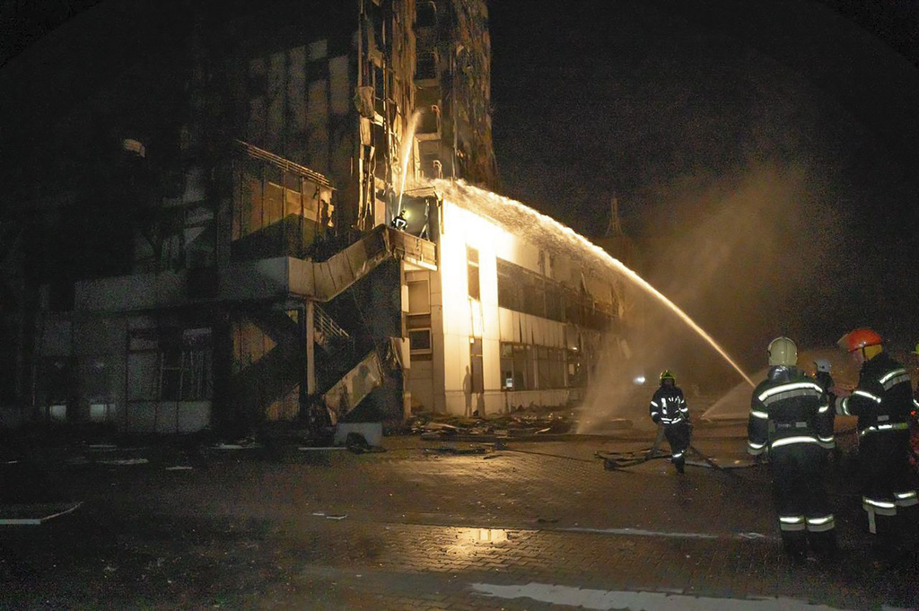 In this photo provided by the Odesa Region Administration, firefighters work to extinguish a fire in a hotel at the seaport after a Russian rocket attack in Odesa, Ukraine, Monday, Sept. 25, 2023.