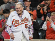 FILE - Former Baltimore Orioles third baseman Brooks Robinson is honored during a ceremony for the Hall of Fame before a baseball game between the Houston Astros and Baltimore Orioles, Sept. 24, 2022, in Baltimore. Robinson, whose deft glovework and folksy manner made him one of the most beloved and accomplished athletes in Baltimore history, has died, according to a joint announcement by the Orioles and his family Tuesday, Sept. 26, 2023.