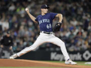 Seattle Mariners starting pitcher George Kirby throws to a Houston Astros batter during the first inning of a baseball game, Tuesday, Sept. 26, 2023, in Seattle.