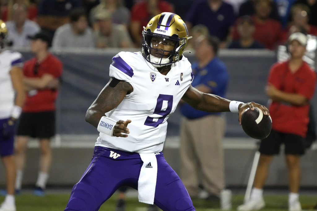 Washington quarterback Michael Penix Jr. looks to pass against Arizona during the first half of an NCAA college football game, Saturday, Sept. 30, 2023, in Tucson, Ariz.