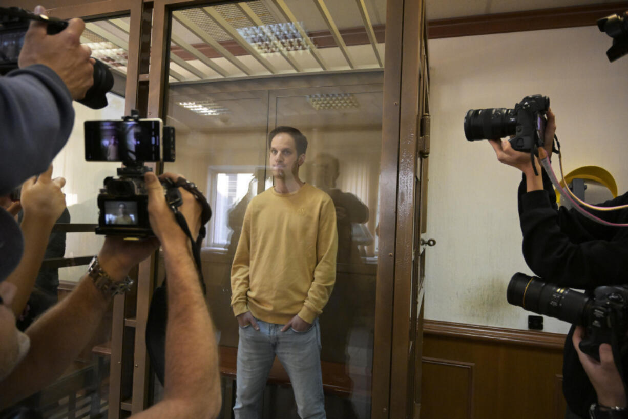 Wall Street Journal reporter Evan Gershkovich stands in a glass cage in a courtroom at the Moscow City Court, in Moscow, Russia, on Tuesday, Sept. 19, 2023. A Russian court on Tuesday is scheduled to hear a defense appeal of Wall Street Journal reporter Evan Gershkovich against the decision to extend his period of detention.