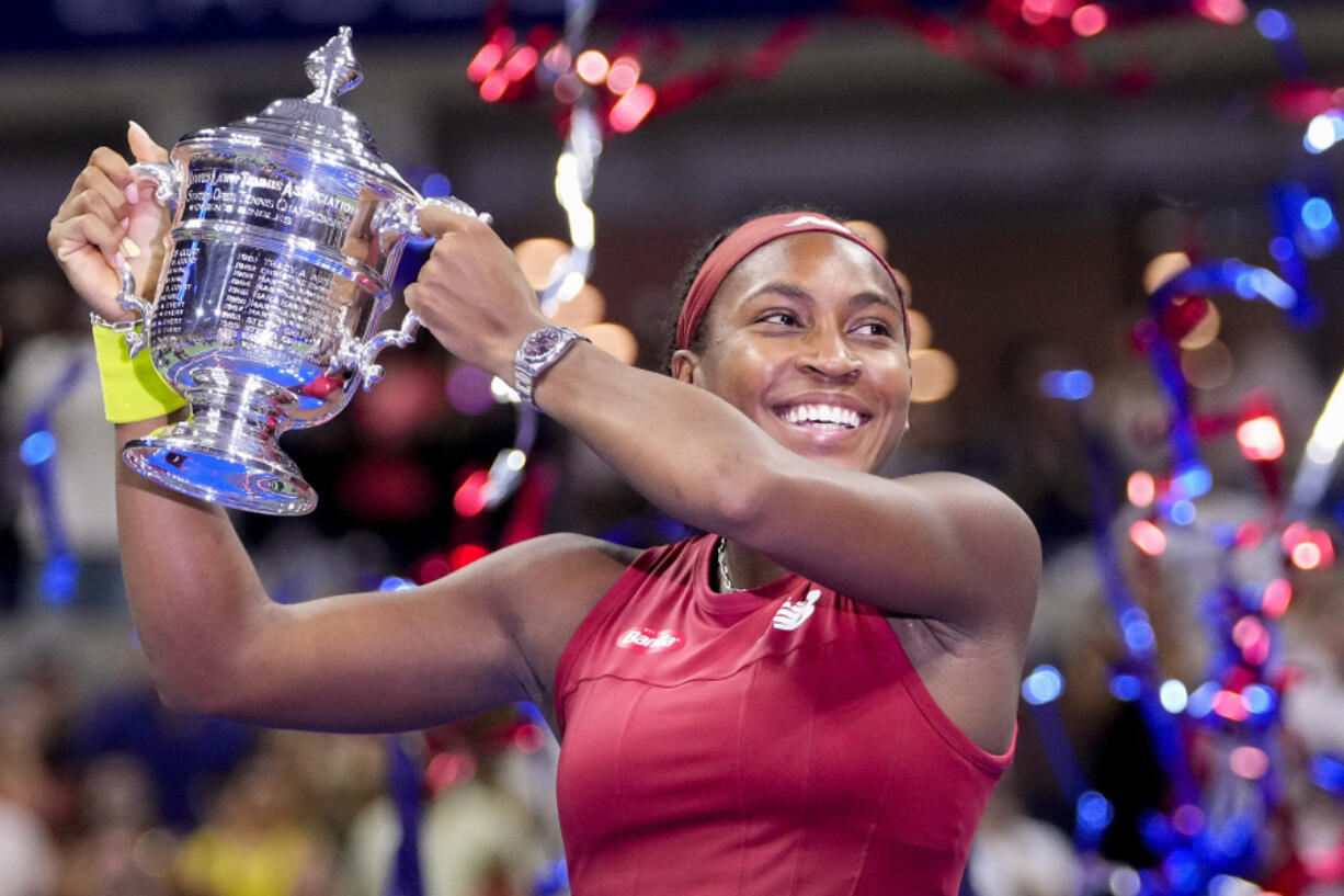 Coco Gauff, of the United States, holds up the championship trophy after defeating Aryna Sabalenka, of Belarus, in the women's singles final of the U.S. Open tennis championships, Saturday, Sept. 9, 2023, in New York.