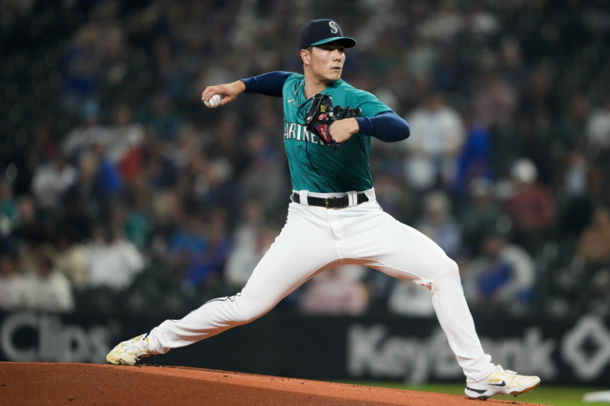 Seattle Mariners starting pitcher Bryan Woo throws against the Los Angeles Angels during the first inning of a baseball game, Tuesday, Sept. 12, 2023, in Seattle.