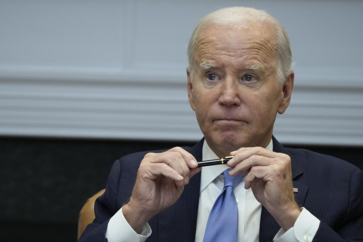 FILE - President Joe Biden pauses after answering a question about the auto workers strike as he speaks in the Roosevelt Room of the White House in Washington, Monday, Sept. 25, 2023.