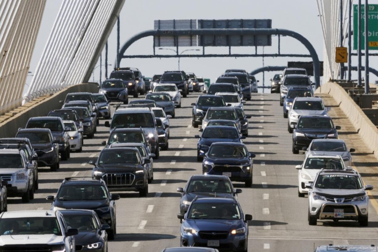 FILE - Heavy traffic heads south on Interstate 93 over the Zakim Bridge, Friday, Sep. 1, 2023, in Boston. Cars are getting an "F" in data privacy. A new study released Wednesday, Sept. 6, 2023, found that most major brands admit they may be selling your personal data, with half saying they will share it with the government or law enforcement without a court order.