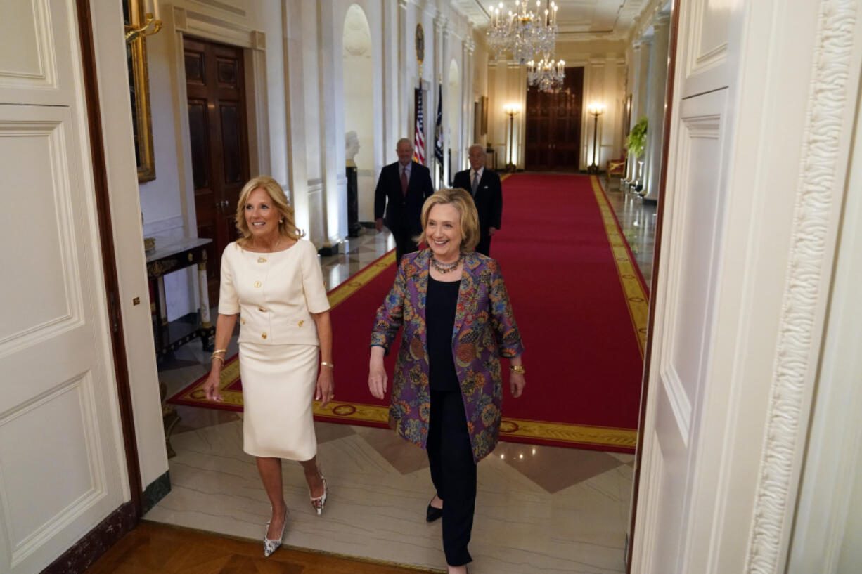 First lady Jill Biden and former Secretary of State Hillary Clinton arrive to speak during an event to celebrate the 2023 Praemium Imperiale Laureates, a global arts prize awarded annually by the Japan Art Association for lifetime achievement in the arts, in the East Room of the White House, Tuesday, Sept. 12, 2023, in Washington.