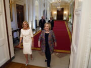 First lady Jill Biden and former Secretary of State Hillary Clinton arrive to speak during an event to celebrate the 2023 Praemium Imperiale Laureates, a global arts prize awarded annually by the Japan Art Association for lifetime achievement in the arts, in the East Room of the White House, Tuesday, Sept. 12, 2023, in Washington.