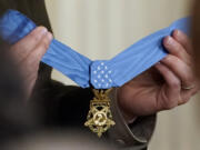 A Medal of Honor is displayed in the East Room of the White House before being awarded to retired Army Col. Paris Davis, Friday, March 3, 2023, in Washington.