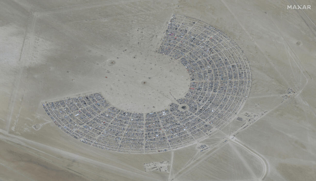 FILE - In this satellite photo provided by Maxar Technologies, an overview of Burning Man festival in Black Rock, Nev on Monday, Aug. 28, 2023. Authorities in Nevada were investigating a death at the site of the Burning Man festival where thousands of attendees remained stranded as flooding from storms swept through the Nevada desert.