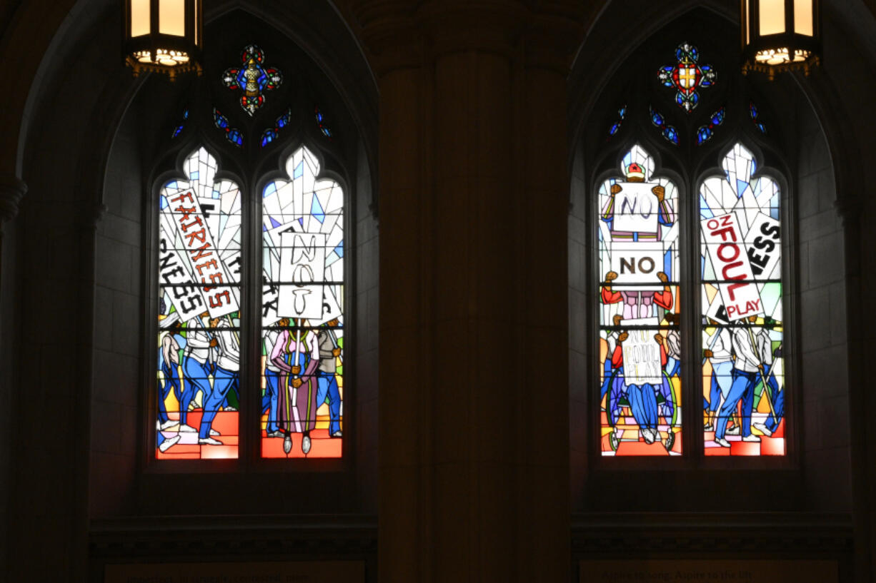 Light shines through new stained-glass windows with a theme of racial justice Sept. 2 during an unveiling and dedication ceremony at the Washington National Cathedral for the window in Washington.