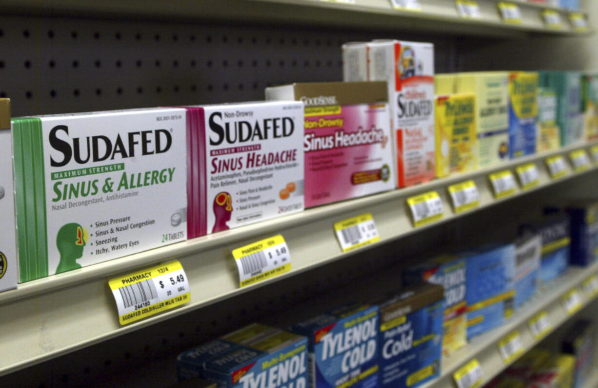 FILE - Sudafed and other common nasal decongestants containing pseudoephedrine are on display behind the counter at Hospital Discount Pharmacy in Edmond, Okla., Jan. 11, 2005. The leading decongestant used by millions of Americans looking for relief from a stuffy nose is likely no better than a dummy pill, according to government experts who reviewed the latest research on the long-questioned drug ingredient. Advisers to the Food and Drug Administration voted unanimously on Tuesday, Sept. 12, 2023 against the effectiveness of the ingredient found in popular versions of Sudafed, Allegra, Dayquil and other medications sold on pharmacy shelves.