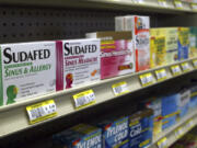 FILE - Sudafed and other common nasal decongestants containing pseudoephedrine are on display behind the counter at Hospital Discount Pharmacy in Edmond, Okla., Jan. 11, 2005. The leading decongestant used by millions of Americans looking for relief from a stuffy nose is likely no better than a dummy pill, according to government experts who reviewed the latest research on the long-questioned drug ingredient. Advisers to the Food and Drug Administration voted unanimously on Tuesday, Sept. 12, 2023 against the effectiveness of the ingredient found in popular versions of Sudafed, Allegra, Dayquil and other medications sold on pharmacy shelves.