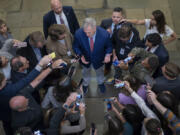 FILE - Speaker of the House Kevin McCarthy, R-Calif., is surrounded by reporters looking for updates on plans to fund the government and avert a shutdown, at the Capitol in Washington, Friday, Sept. 22, 2023. (AP Photo/J.