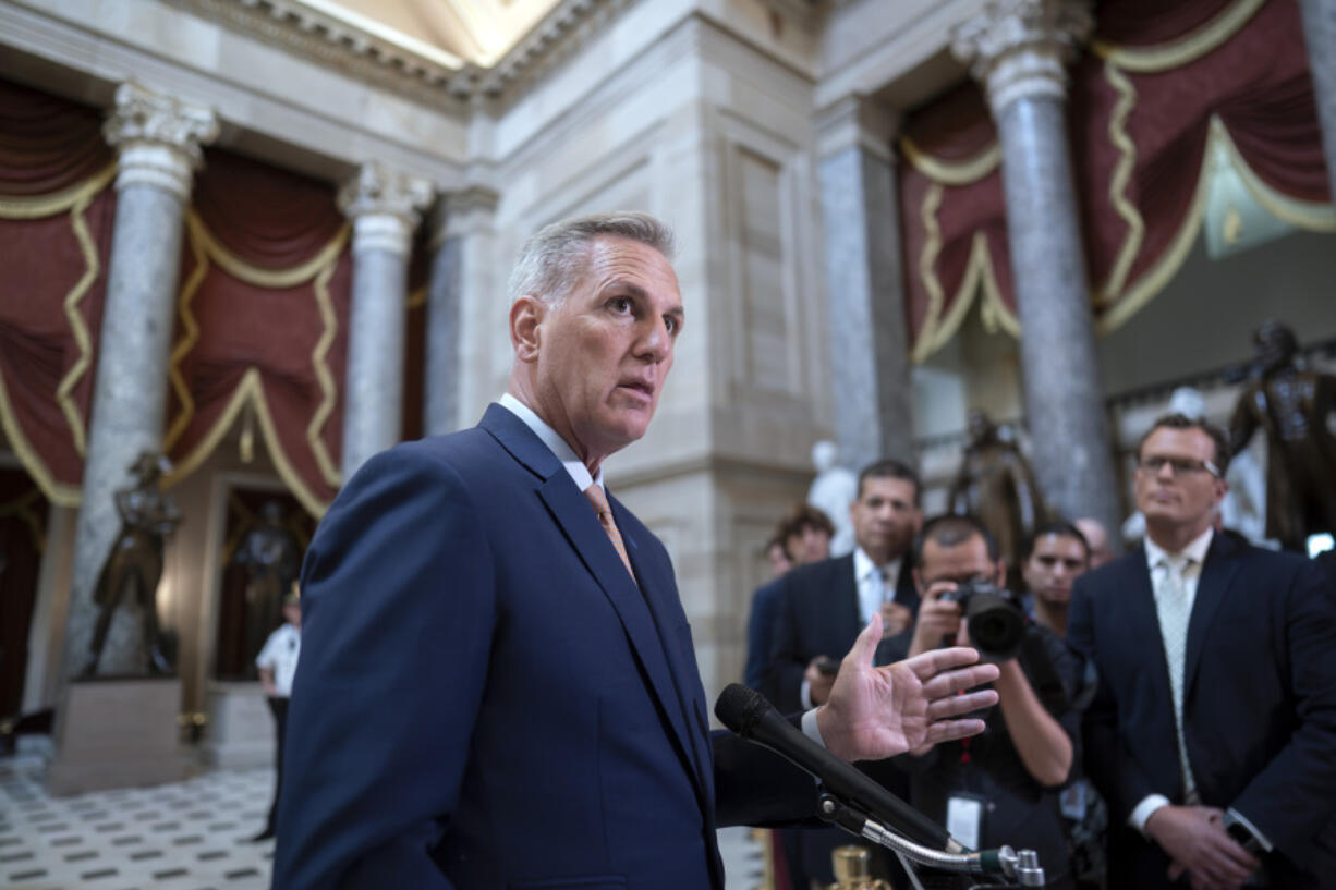 FILE - Speaker of the House Kevin McCarthy, R-Calif., talks to reporters at the Capitol in Washington, Monday, July 17, 2023. McCarthy faces a political standoff when the House resumes this week. He needs to steer the House to fund the government and avoid a government shutdown. But he's also trying to launch an impeachment inquiry into President Joe Biden over his son Hunter Biden's business dealings. (AP Photo/J.